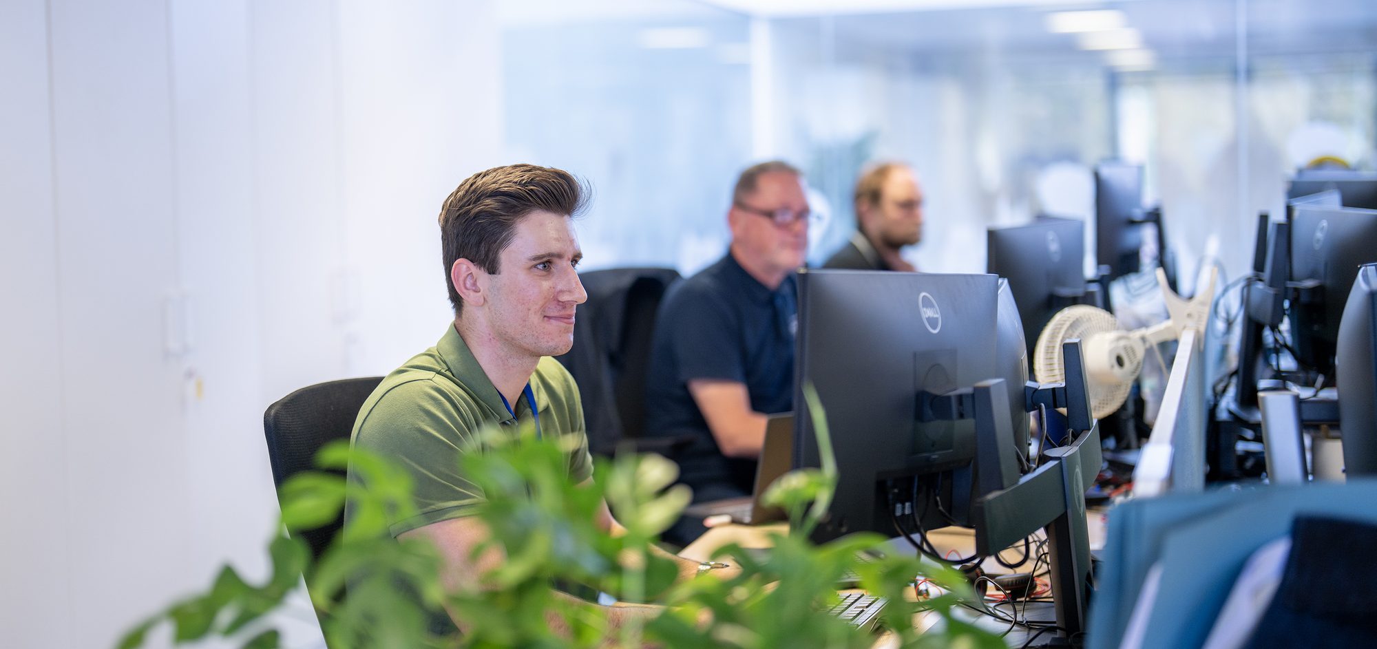 Frazer-Nash colleagues working together in the office